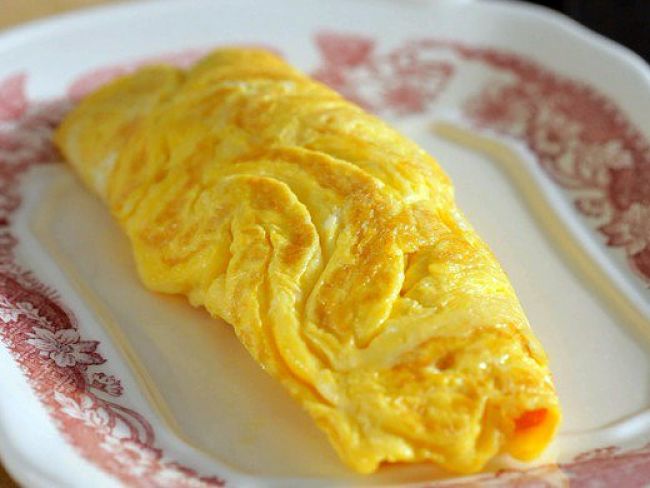 Adding cheese to the mixture tends to create an omelet with a firm texture